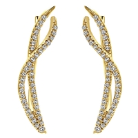 This 14k yellow gold diamond wave cuff earring set features delicate curves and an elegant style.