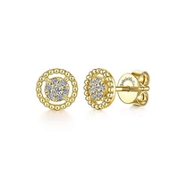 This pair of `4k yellow gold diamond stud earrings feature diamond accents floating in a beaded halo.