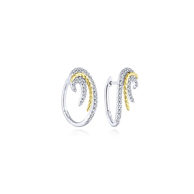 Swirling 14k white gold diamond huggie earrings with 0.55 carats of diamonds.