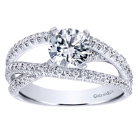 This round brilliant diamond engagement ring with a fresh new design shows off a round center diamond in the middle of over one half carats of round brilliant diamonds.