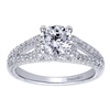 This wonderfully set round diamond split shank diamond engagement ring shimmers and glistens with over one quarter carats of round brilliant diamonds and is offered to you in white gold or platinum.