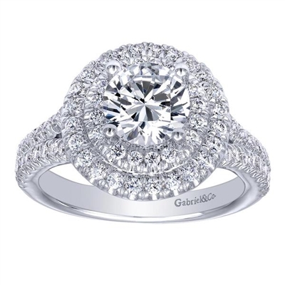 Double rows of round brilliant diamonds wrap around the round center diamond of your choice in this glistening halo diamond engagement ring featured in either 14k, 18k or platinum!