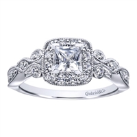 This flowing white gold or platinum princess halo engagement ring shimmers with almost one half carats of round brilliant diamonds, ad its rose-like shank is reminiscent of a flower in bloom.