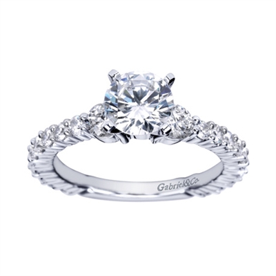 An 18k white gold eternity engagement ring with contemporary and modern styling, shining with nearly 1 full carat in round brilliant diamonds.