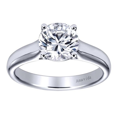A strong and durable relationship needs a strong and durable engagement ring, this contemporary solitaire engagement ring will do the job and more, perfectly holding a round center diamond!