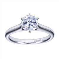 White gold or platinum bands rise towards the center of this solitaire engagement ring with a contemporary finish.