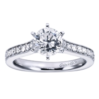 Round brilliant diamonds slide all the way up to this vintage style straight engagement ring's center, which should hold a round center diamond of your choice.