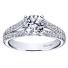 Double diamond rows of round brilliant diamonds crawl their way up this split shank diamond engagement ring, meeting a round center diamond of oyur choice.