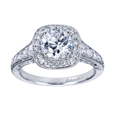 A stunning and well-decorated vintage style halo engagement ring with over half a carat in round brilliant diamonds.