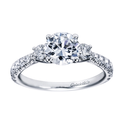 Blending round brilliant diamonds with your choice of white gold or platinum, this 3 stone contemporary engagement ring is an excellent pick.
