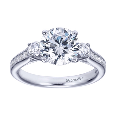 A 3 stone engagement ring with some style, this engagement ring is available in white gold or platinum and comes set with 0.50 carats in round diamonds.