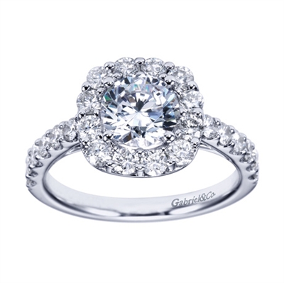 A glistening contemporary round diamond halo engagement ring available in your choice of white gold or platinum.