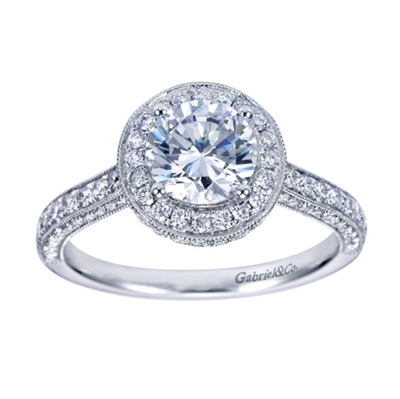 Your choice of platinum or white gold in this vintage style halo engagement ring with 3/4 carats of round brilliant diamonds and a round center diamond of your choice.