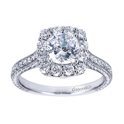 A gorgeous and different take on a contemporary halo engagement ring, the round brilliant diamonds are larger than usual, engagement ring available in choice of gold or platinum.