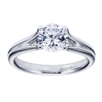 A white gold solitaire engagement ring with a contemporary twist! Designed by Gabriel & Co.