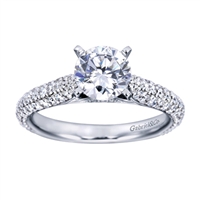 A Round center diamond perfectly compliments the straight band of this contemporary white gold diamond engagement ring.