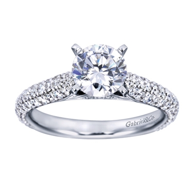 A Round center diamond perfectly compliments the straight band of this contemporary white gold diamond engagement ring.