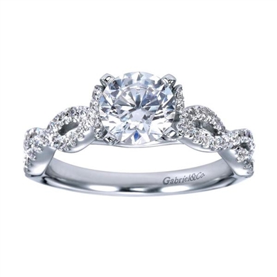 This diamond strewn contemporary criss cross diamond engagement ring lights up with one third carats of round brilliant diamonds and a twisted and criss crossing diamond bands lead up to a round diamond.