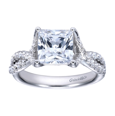 A princess cut center diamond sits in the middle of criss cross split shank bands, all covered in round brilliant diamonds in this platinum criss cross engagement ring.