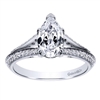 This diamond encrusted engagement ring holds a pear cut center diamond and holds 1/3  carats of round diamonds in its split shank diamond engagement ring setting.