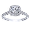 This round brilliant diamond halo engagement ring features a round center diamond and side round diamonds all included in this engagement ring!