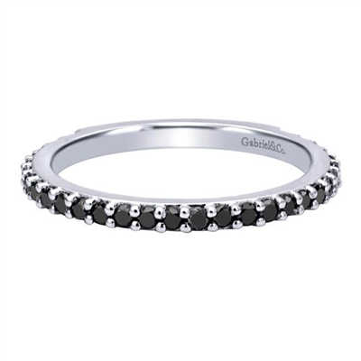 This unique 14k white gold stackable ring shimmers with round black diamonds set in an eternity style .