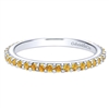 This 14k white gold stackable ring features citrine stones.