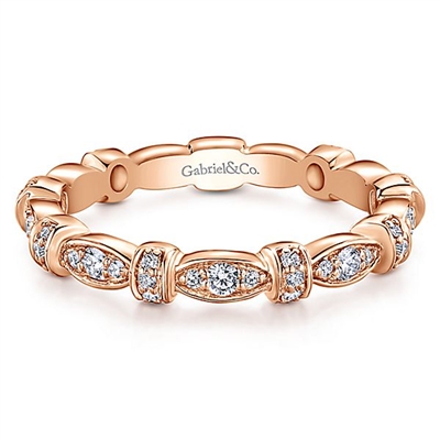 A 14k rose gold diamond stackable ring with 0.27 carats of diamonds.