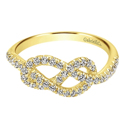 A single 14k yellow gold band wraps itself in knots with nearly one half carats of round brilliant diamonds laid into the warm yellow gold.