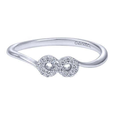 This 14k white gold diamond infinity ring features diamond accents in the infinity shape with a simple and sleek 14k white gold shank.