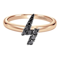 Black diamonds shine over pink gold in this creative and funky lightning bolt ring.