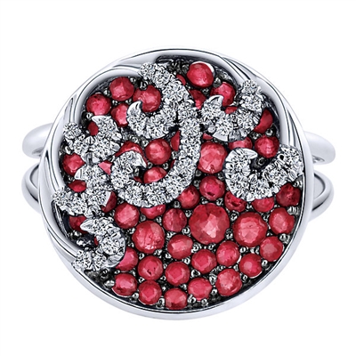 This spherical white gold, ruby and diamond fashion ring features beautifully set bright red gemstones and sparkling white diamonds in a clever pattern over 14k white gold.