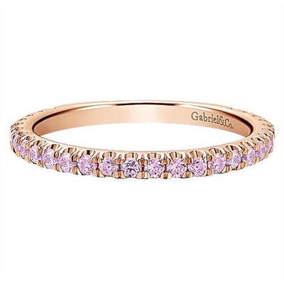 This 14k rose gold eternity stackable ring features pink stones.