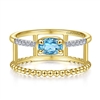 This uniquely styled 14k yellow gold diamond and blue topaz ring features beaded 14k yellow gold.