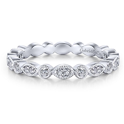 This 14k white gold stackable ring contains nearly one third carats of round brilliant diamonds.