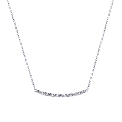 This curved diamond bar necklace features 0.20 carats of diamonds gently curving with 14k white gold.