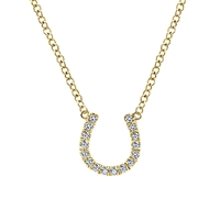 This diamond horseshoe necklace features shimmering diamond accents in the familiar and comforting equestrian symbol done in 14k yellow gold.