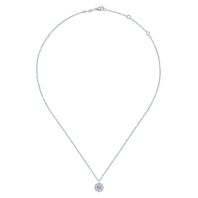 This simple and stunning diamond cluster necklace features 0.40 carats of diamond brilliance loaded into this modern motif.