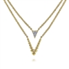 This trendy yellow gold diamond necklace features two layered sections in 14k yellow gold.