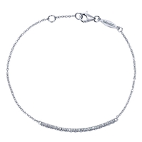 This shimmering diamond bracelet showcases 0.14 carats of round brilliant diamonds lining up in a single,glistening row in this 14k white gold diamond bar bracelet.