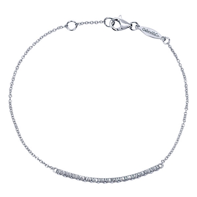 This shimmering diamond bracelet showcases 0.14 carats of round brilliant diamonds lining up in a single,glistening row in this 14k white gold diamond bar bracelet.