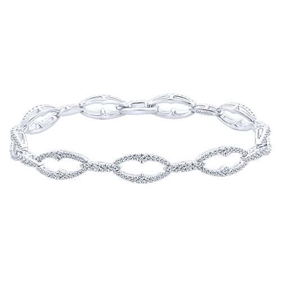 This 14k white gold diamond link tennis bracelet boasts over 1.5 carats of diamonds set into alternating white gold oval and bar sections.