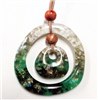 Two fused glass pendants strung together. The larger is an open circle. Strung inside is a smaller, solid circle. There is a wooden bead between them and a wooden bead above the larger pendant. The pendants are mainly green and white.