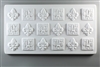 A long rectangular tile made of white ceramic. The carved texture has eighteen fleur-de-lis emblems arranged in three rows of six. Every other emblem has a square background around it.