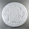 A circular tile made of white ceramic. The carved texture has a top-down view of five koi fish swimming around the outside. There are gentle waving lines surrounding the fish and coming together in a loose spiral in the otherwise empty center.