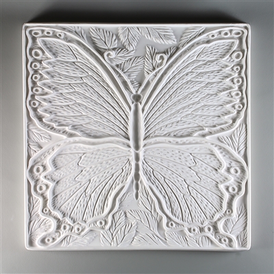 A large square tile made of white ceramic. The carved texture is occupied primarily by a single large and detailed butterfly. There are a few leaves in the empty spaces around the butterfly, and a thin border around the entire tile.