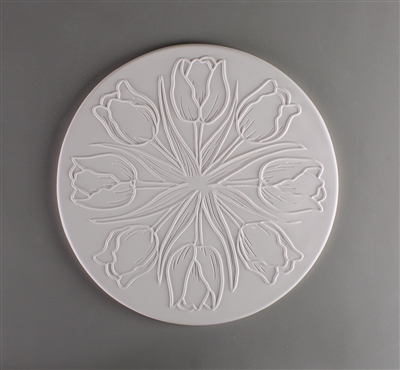 A circular tile made of white ceramic. The carved texture has eight tulips radiating outwards from the center with their flowers facing the edge of the tile. Each flower has two thin leaves on either side of it.