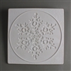 A large square tile made of white ceramic. The carved texture shows a single snowflake in the center. The snowflake is embossed inwards. It is surrounded by a raised circle. The space between the circle and mold edge is lightly textured.