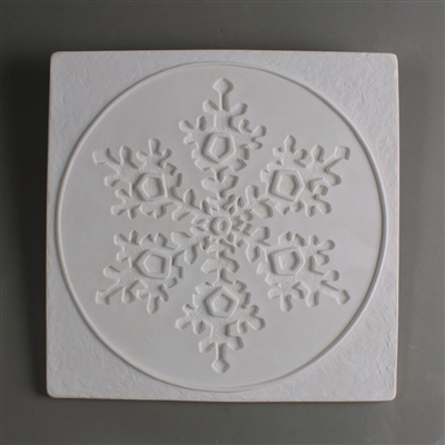 A large square tile made of white ceramic. The carved texture shows a single snowflake in the center. The snowflake is embossed inwards. It is surrounded by a raised circle. The space between the circle and mold edge is lightly textured.