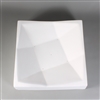 A square white ceramic mold for fusing glass on a grey background. The edges are raised and slope inwards to create a bowl-like shape. The interior of this shape has been carefully carved with several lines to mimic folded paper.